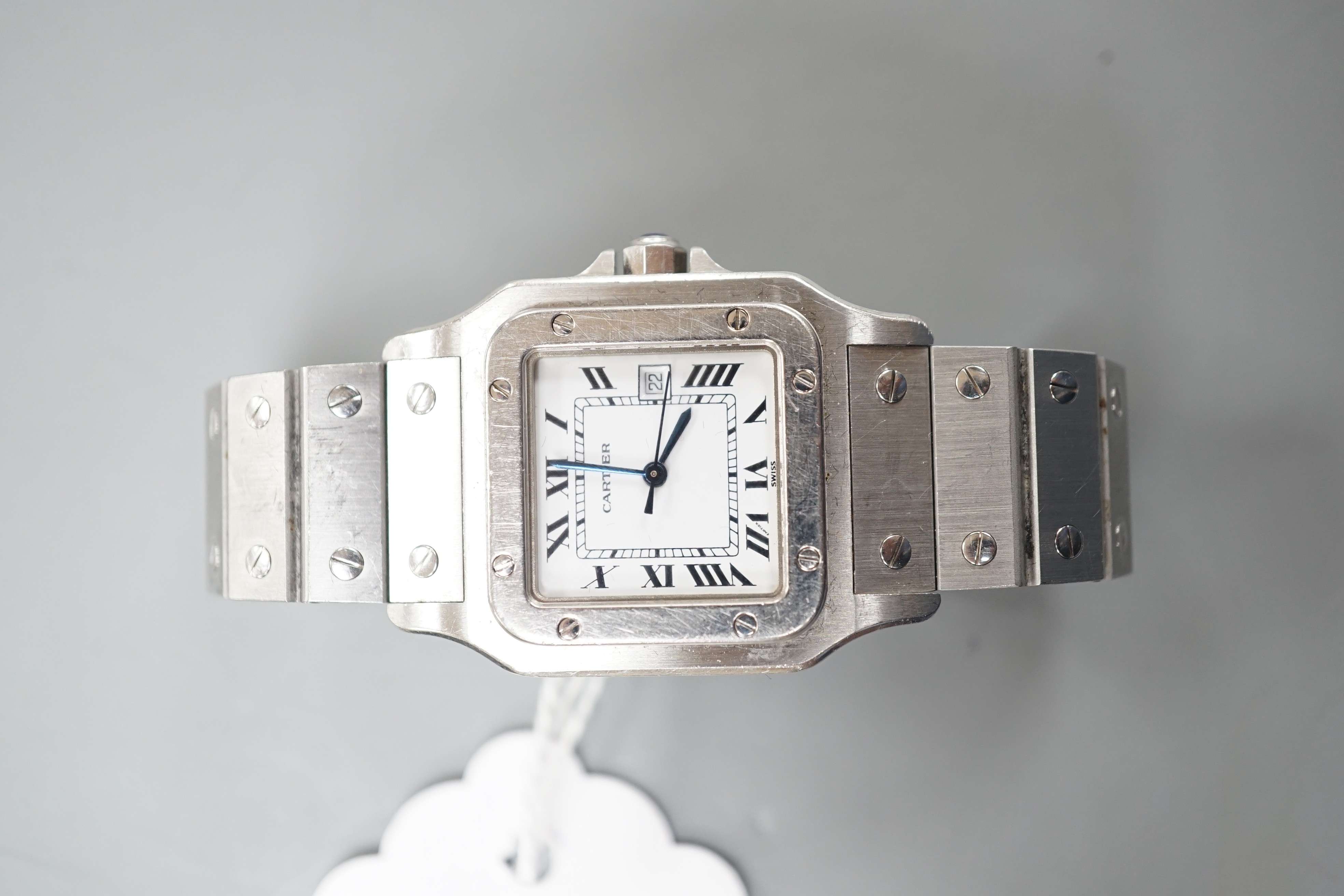 A gentleman's stainless steel Santos de Cartier automatic wrist watch, with Roman dial and date aperture, case diameter 29mm, no box or papers.